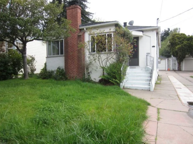 Client photo of a plain suburban front yard before landscaping